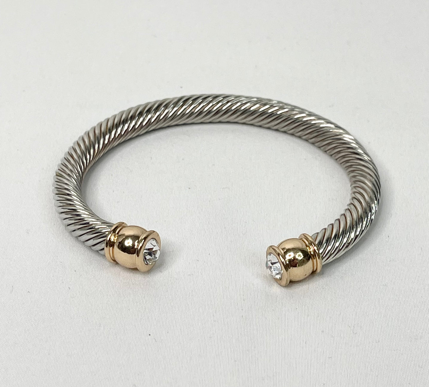 Silver Tone Cable Cuff Bracelet with Gold and Clear Rhinestone Ends